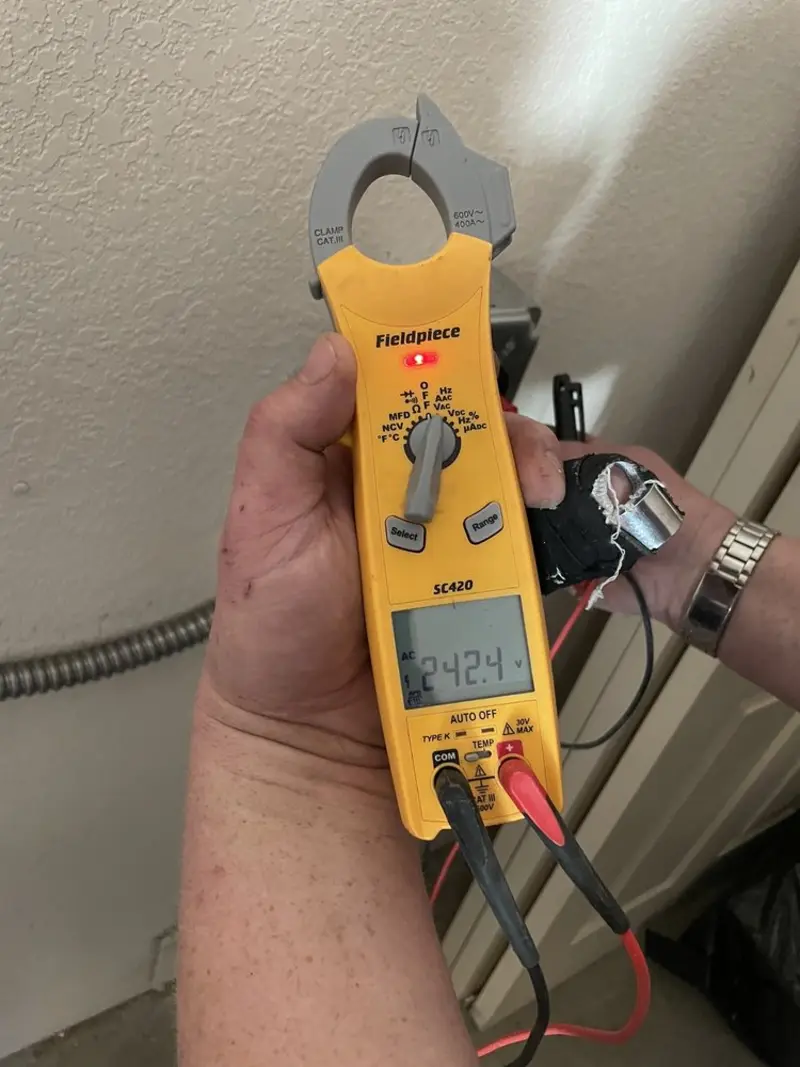 Voltage testing with clamp meter during Outlet Installation in Gallatin